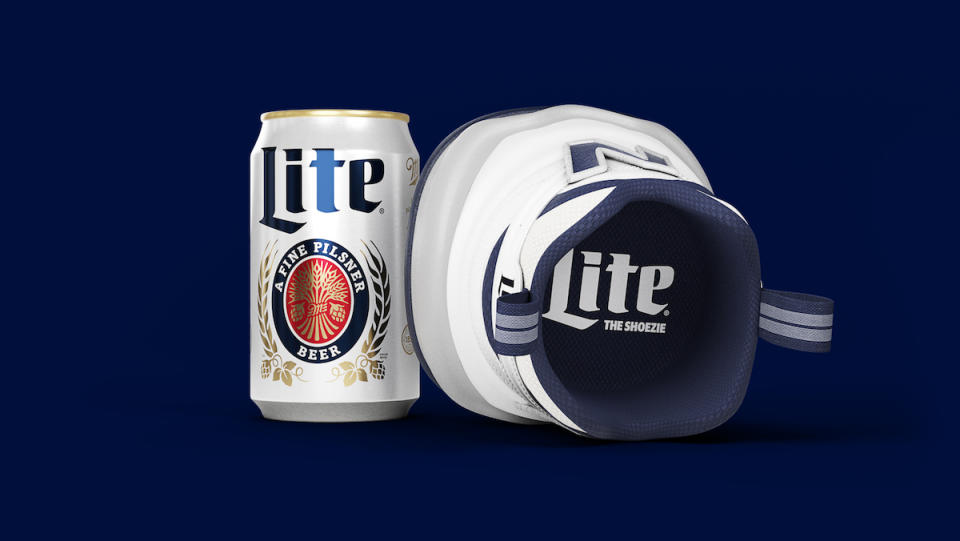 A white can of Miller Lite next to a sneaker designed to hold a beer on its side