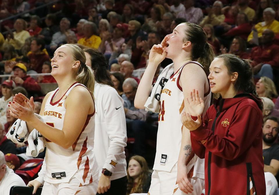 Iowa State Cyclones guard Hannah Belanger (13), Iowa State Cyclones forward Addy Brown (24), and Iowa State Cyclones guard Mary Kate King (12) cheer from the bench during the fourth quarter against North Dakota State of an NCAA women's basketball at Hilton Coliseum on Sunday, Dec. 10, 2023, in Ames, Iowa.