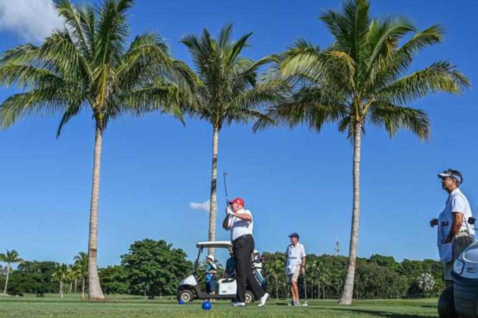 Donald Trump plays golf at Trump National Doral Miami golf club on 27 October 2022 (AFP via Getty Images)