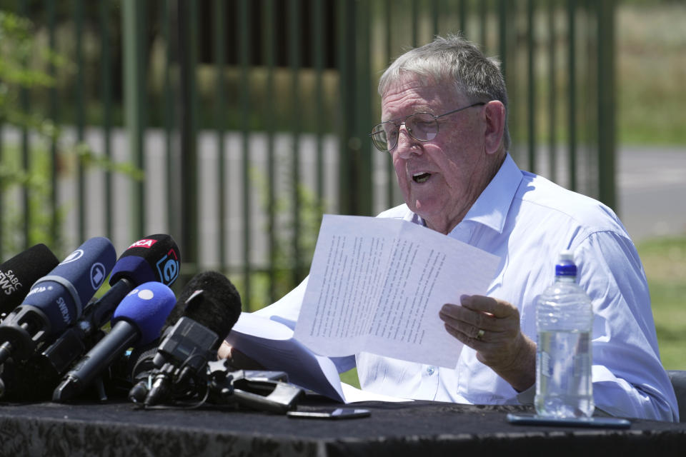 Rob Mathews, the Steenkamp family representative, reads the witness impact statement submitted to the parole body looking into the possible release of Oscar Pistorius, outside the Atteridgeville Prison, in Pretoria, South Africa, Friday, Nov. 24, 2023. The double-amputee Olympic runner was convicted of a charge comparable to third-degree murder for shooting Reeva Steenkamp in his home in 2013. (AP Photo/ Tsvangirayi Mukwazhi)