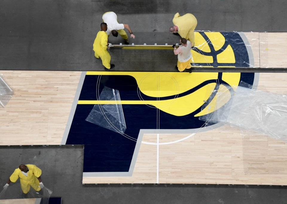 It takes four people to remove each piece of the Pacers' court.