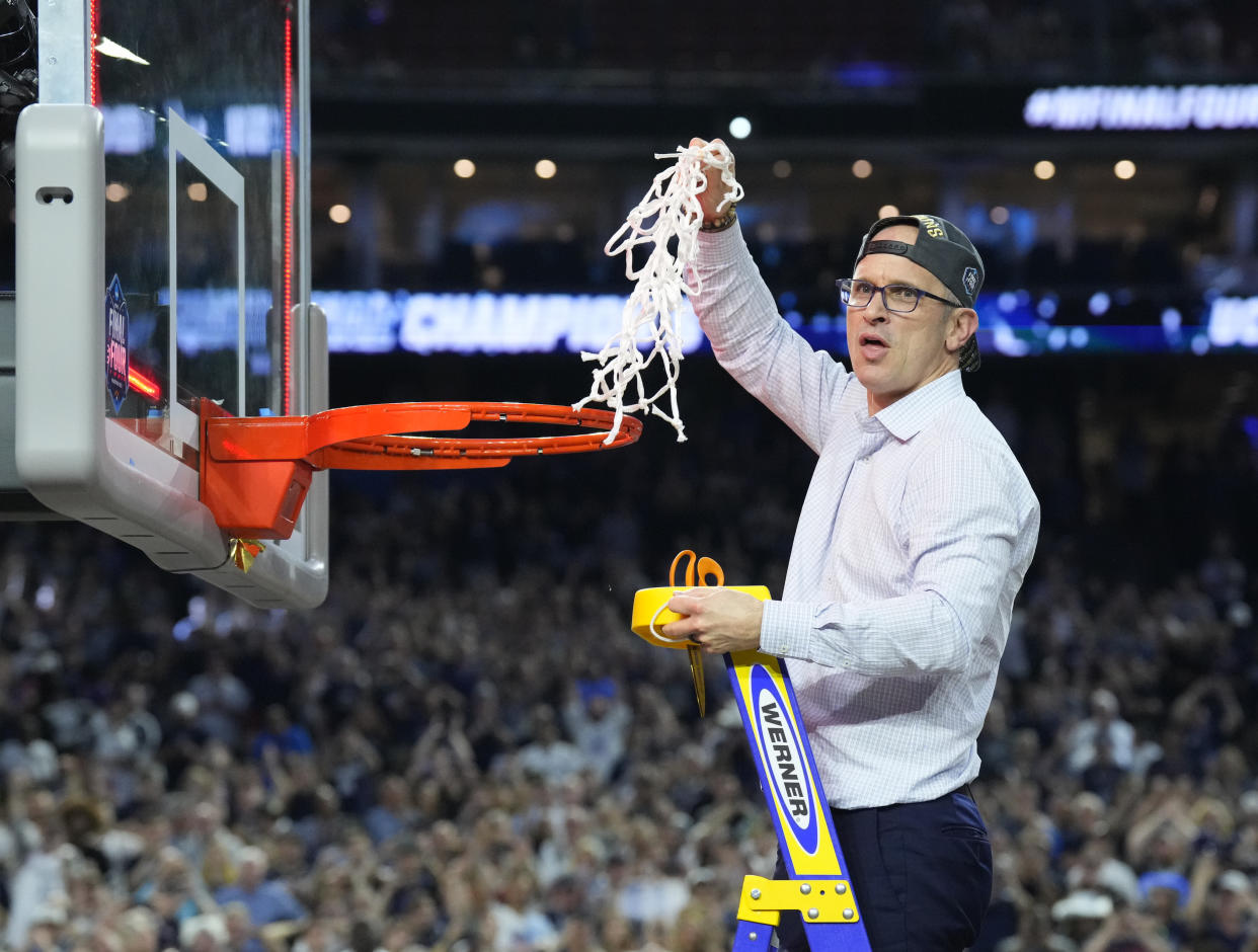 Apr 3, 2023; Houston, TX, USA; Connecticut Huskies head coach Dan Hurley cuts down the net after defeating the San Diego State Aztecs in the national championship game of the 2023 NCAA Tournament at NRG Stadium. Mandatory Credit: Robert Deutsch-USA TODAY Sports