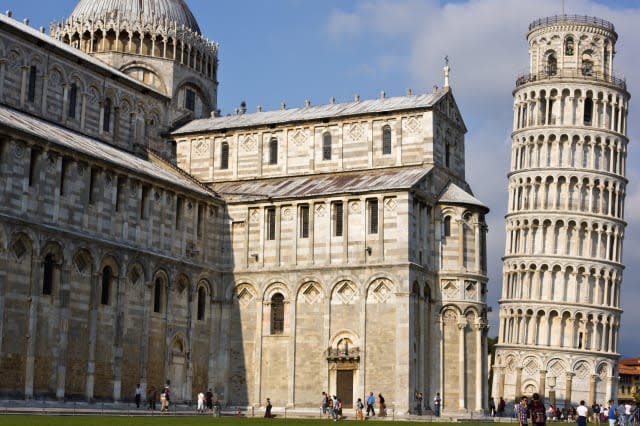 Tourists near a tower and cathedral, Pisa Cathedral, Leaning Tower of Pisa, Pisa, Tuscany, Italy