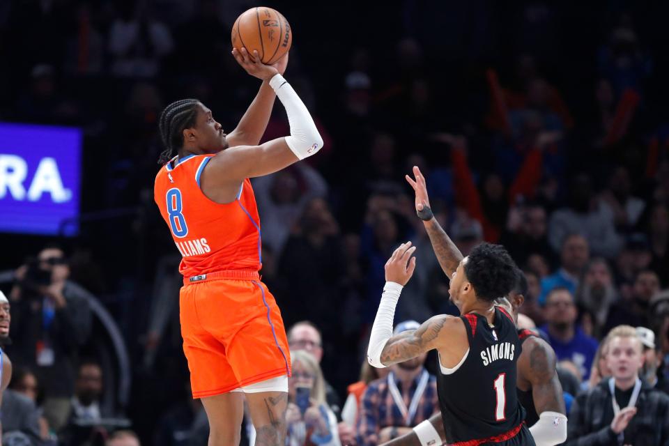 Thunder forward Jalen Williams (8) makes the go-ahead a basket over Trail Blazers guard Anfernee Simons (1) in the finals seconds of OKC's 111-109 win Tuesday night at Paycom Center.