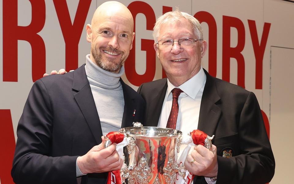 Erik ten Hag and Sir Alex Ferguson celebrate with the Carabao Cup