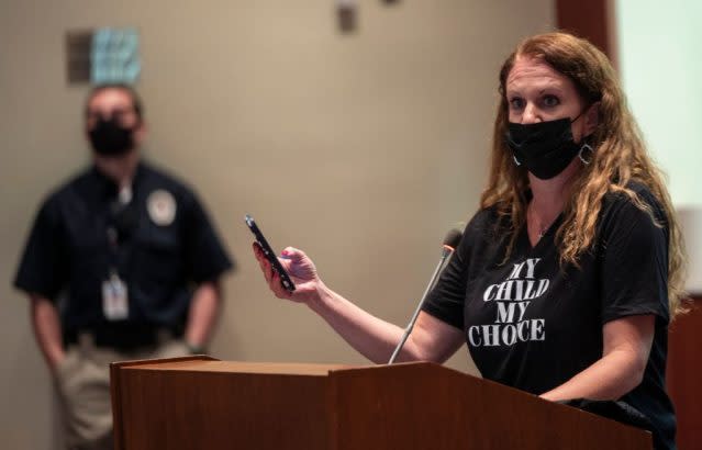 Community member Patti Hidalgo Menders speaks at a board meeting for Loudoun County Public Schools, the third-largest school district in Virginia. The area has become a flashpoint for parental protests against what is often referred to as “critical race theory.” (Andrew Caballero-Reyonds / Getty Images)