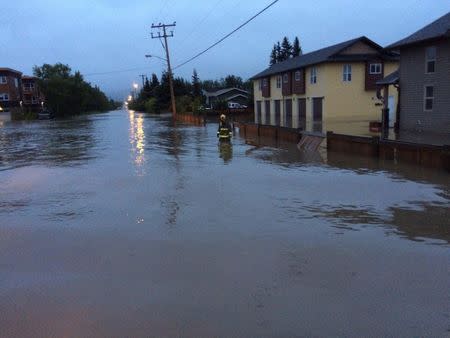 A flooded neighborhood in the City of Dawson Creek is seen in this Dawson Creek Fire Fighters Association photo posted on social media in British Columbia, Canada on June 17, 2016. Courtesy Dawson Creek Fire Fighters Association/Handout