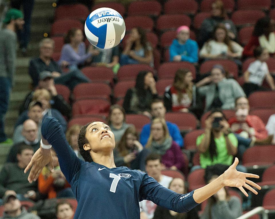 Penn State Nittany Lions middle hitter Nia Grant serves the ball. The Nittany Lions defeated the WisconsinBadgers, 3-1 to win the the NCAA Louisville Regional Championship and move on to the national semifinal game.11 December 2014