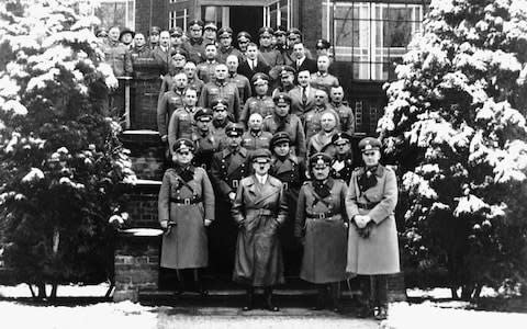 SS officer and aeronautical engineer Wernher von Braun (second row from back, in dark suit and tie) with the Nazi high command in 1934 - Credit: Sammlung Wolfgang Fleischer / Picture Alliance