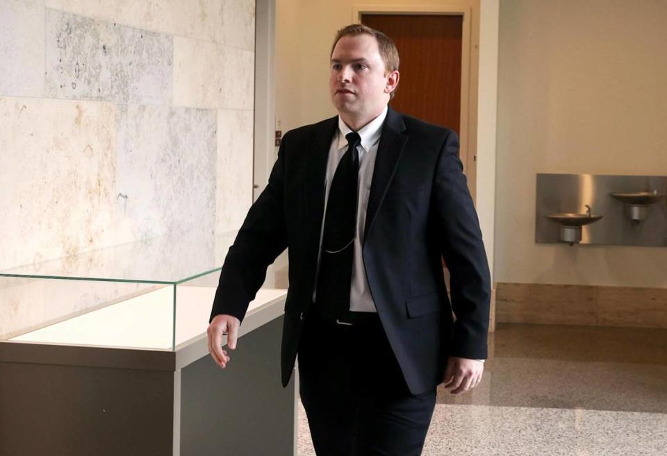 Aaron Dean, who is charged with the murder of Atatiana Jefferson, walks into the courtroom following a break in a pre-trial hearing on April 4, 2022, in Fort Worth. Dean’s trial begins today in Tarrant County.