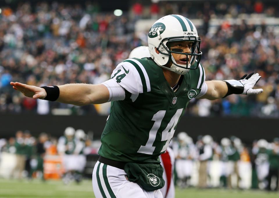 Greg McElroy #14 of the New York Jets celebrates throwing his first touchdown in the NFL to Jeff Cumberland #86 against the Arizona Cardinals during their game at at MetLife Stadium on December 2, 2012 in East Rutherford, New Jersey. The Jets won 7-6. (Photo by Al Bello/Getty Images)