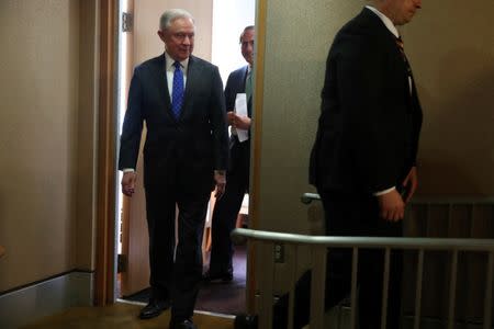 U.S. Attorney General Jeff Sessions (L) and Secretary of Health and Human Services (HHS) Alex Azar (2nd L) arrive for a news conference to announce a nation-wide health care fraud and opioid enforcement action, at the Justice Department in Washington, U.S. June 28, 2018. REUTERS/Jonathan Ernst