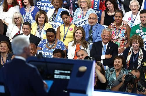 Delegates listen to Clinton deliver remarks on the second day of the Democratic National Convention. Source: Getty.