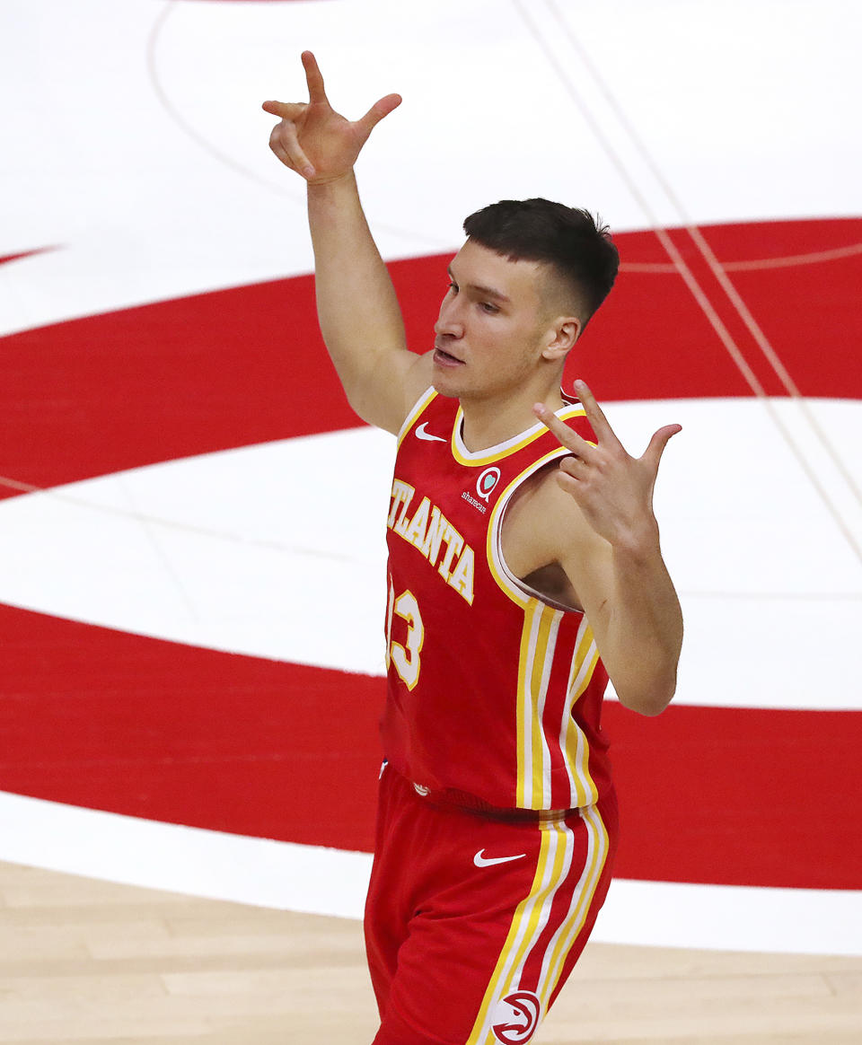 Atlanta Hawks guard Bogan Bogdanovic reacts to hitting a three pointer against the Washington Wizards in an NBA basketball game against the Washington Wizards Wednesday, May 12, 2021, in Atlanta. (Curtis Compton/Atlanta Journal-Constitution via AP)