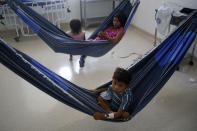 Yanomamis rest in hammocks at the Santo Antonio Children's Hospital, in Boa Vista, Roraima state, Brazil, Thursday, Jan 26, 2023. Brazil's government declared a public health emergency for the Yanomami people in the Amazon, who are suffering from malnutrition and diseases such as malaria. (AP Photo/Edmar Barros)