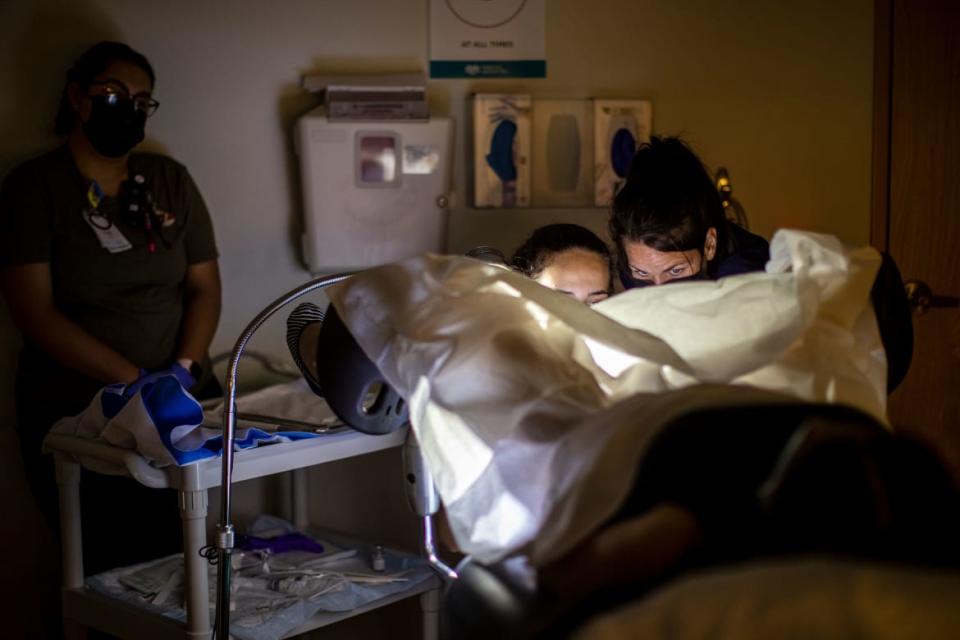 <div class="inline-image__caption"><p>A family physician and her resident perform a surgical abortion on a 39-year-old woman who already has four children the day before the Supreme Court overturned Roe v. Wade in Albuquerque, New Mexico. New Mexico will see an influx of patients from neighboring states that have banned abortion.</p></div> <div class="inline-image__credit">Gina Ferazzi/The Los Angeles Times via Getty</div>