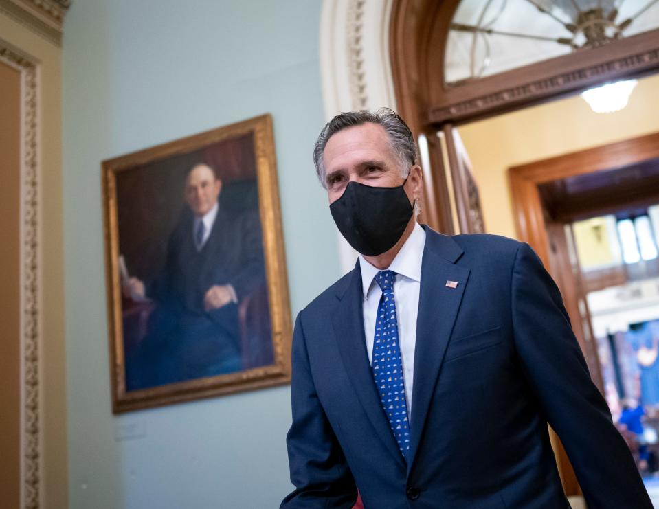 Sen. Mitt Romney, R-Utah, arrives at the Senate for a roll call vote to confirm Antony Blinken, President Joe Biden's nominee to be secretary of State, at the Capitol in Washington, Tuesday, Jan. 26, 2021. The senators will be sworn in later as jurors in the impeachment of former President Donald Trump. (AP Photo/J. Scott Applewhite) ORG XMIT: DCSA131