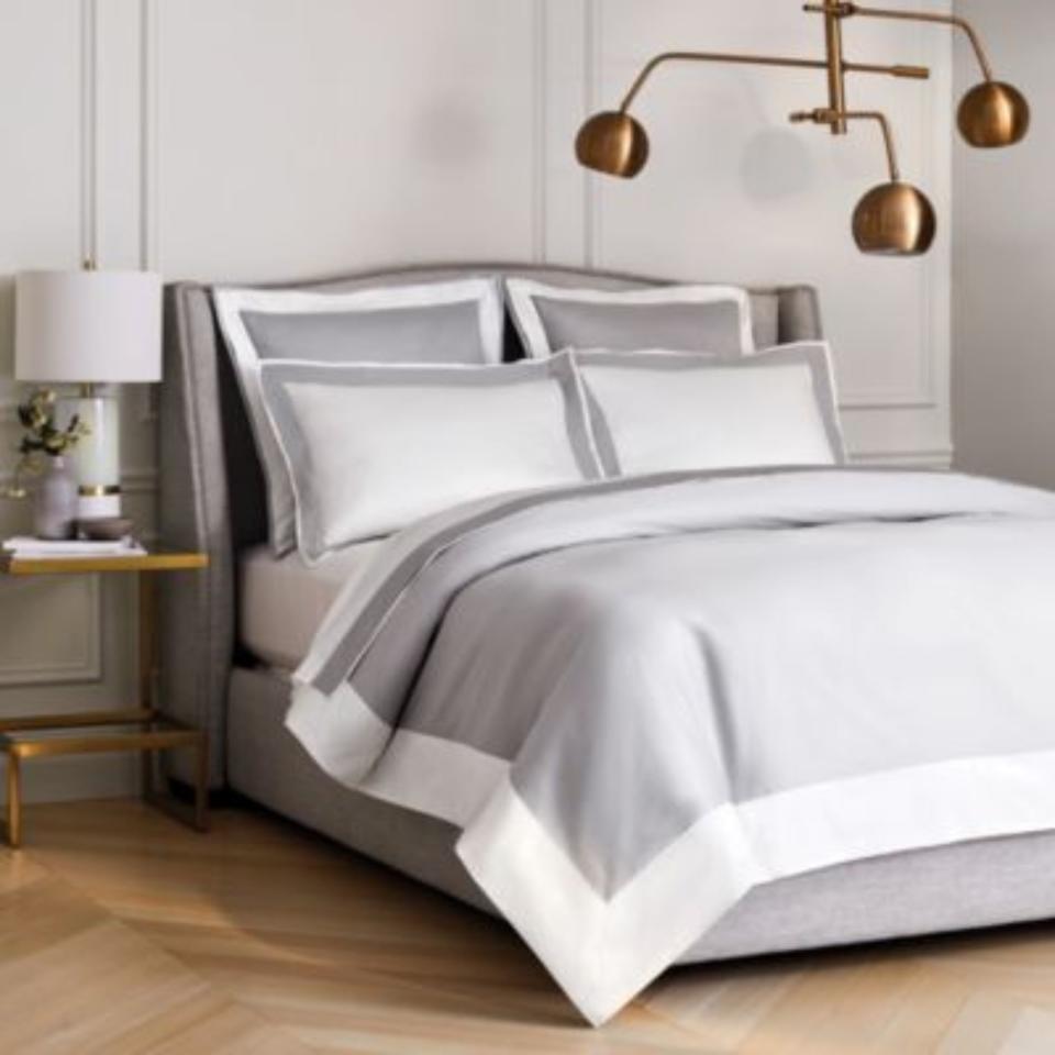 Frette Flying Bedding Collection on a bed.