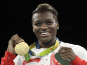 <p>Britain’s Nicola Adams displays her gold medal for the women’s flyweight 51-kg boxing at the 2016 Summer Olympics in Rio de Janeiro, Brazil, Saturday, Aug. 20, 2016. (AP Photo/Frank Franklin II) </p>