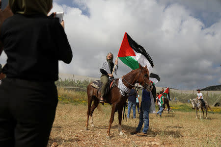 Israeli Arabs take part in a rally calling for the right of return for refugees who fled their homes during the 1948 Arab-Israeli War, near Atlit, Israel April 19, 2018. REUTERS/Ammar Awad