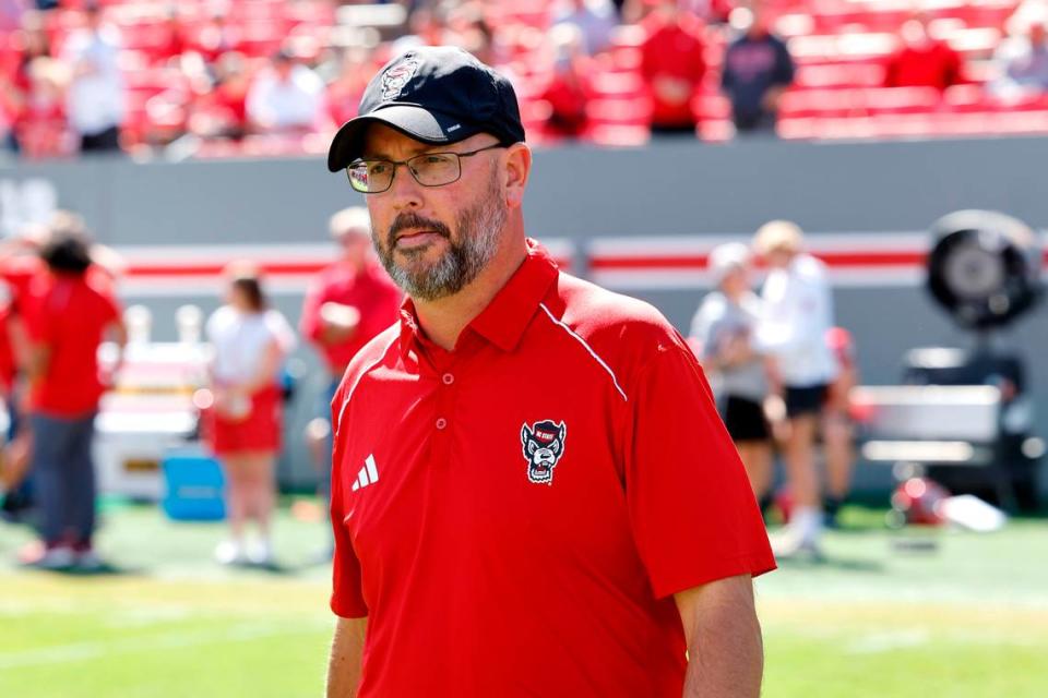 N.C. State quarterbacks coach Kurt Roper walks the field during warmups before the Wolfpack’s game against Marshall at Carter-Finley Stadium in Raleigh, N.C., Saturday, Oct. 7, 2023.