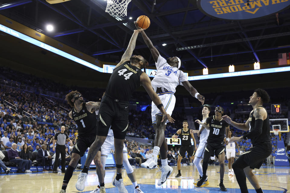 UCLA forward Adem Bona (3) rebounds the ball against Colorado center Eddie Lampkin Jr. (44) during the second half of an NCAA college basketball game Thursday, Feb. 15, 2024, in Los Angeles. (AP Photo/Raul Romero Jr.)
