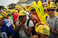 <p>A man covers his ears from noise as people attend the Annual Nathan’s Hot Dog Eating Contest on July 4, 2018 in the Coney Island neighborhood of the Brooklyn borough of New York City. In 2017 winner Joey Chestnut set a Coney Island record eating 72 hot dogs. (Photo: Eduardo Munoz Alvarez/Getty Images) </p>