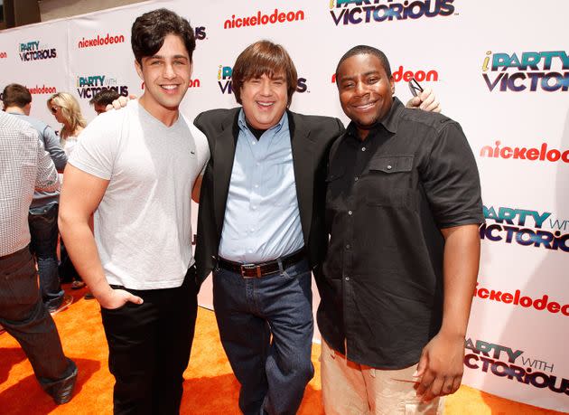 Producer Dan Schneider (center) poses for a photo with actor Josh Peck (left) and actor Kenan Thompson (right) at a Nickelodeon premiere in 2011. Schneider is accused of misconduct in a report from Insider. (Photo: Christopher Polk/Getty Images for Nickelodeon)