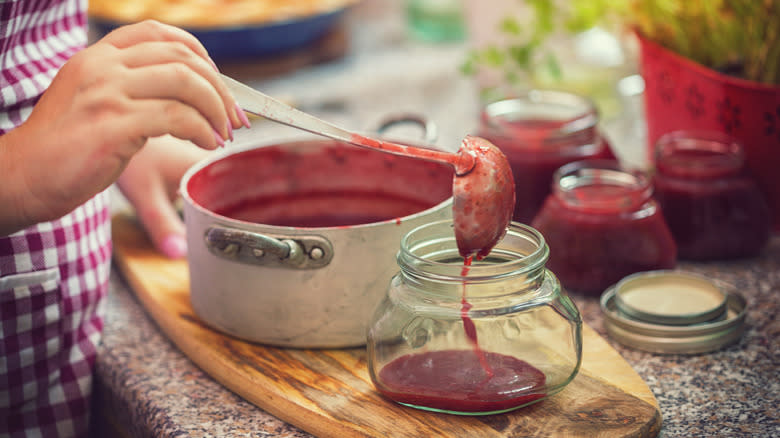 filling a jar with jam