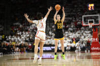 Iowa guard Caitlin Clark (22) shoots against Maryland guard Lavender Briggs (3) during the first half of an NCAA college basketball game, Saturday, Feb. 3, 2024, in College Park, Md. (AP Photo/Nick Wass)