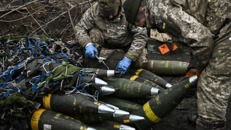 Ukrainian servicemen prepare to fire toward Russian positions with a 155mm M777 howitzer near the city of Bakhmut on March 11, 2023. (Aris Messinis/AFP via Getty Images)