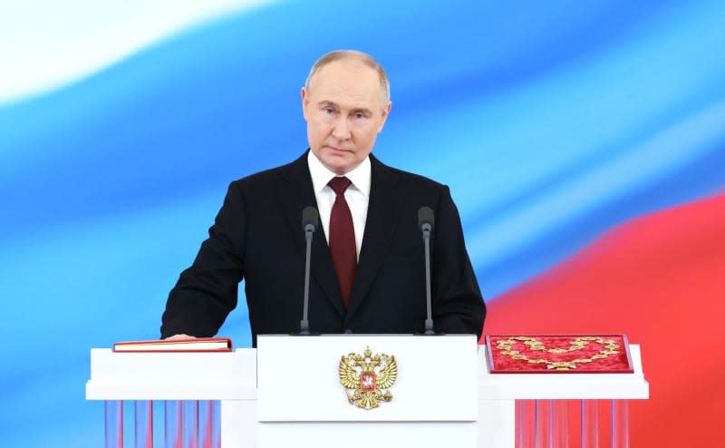 Russian President Vladimir Putin takes the oath during his inauguration ceremony as President of the Russian Federation in the Kremlin. -/Kremlin/dpa