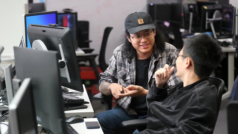 Masters of Entertainment Arts and Engineering graduate students Mingyuan Yang and Weixang Yan work on a game called Sunbeam for the Masters of Entertainment Arts and Engineering graduate program in Building 72, the former law library, at the University of Utah in Salt Lake City on Tuesday, March 26, 2024.