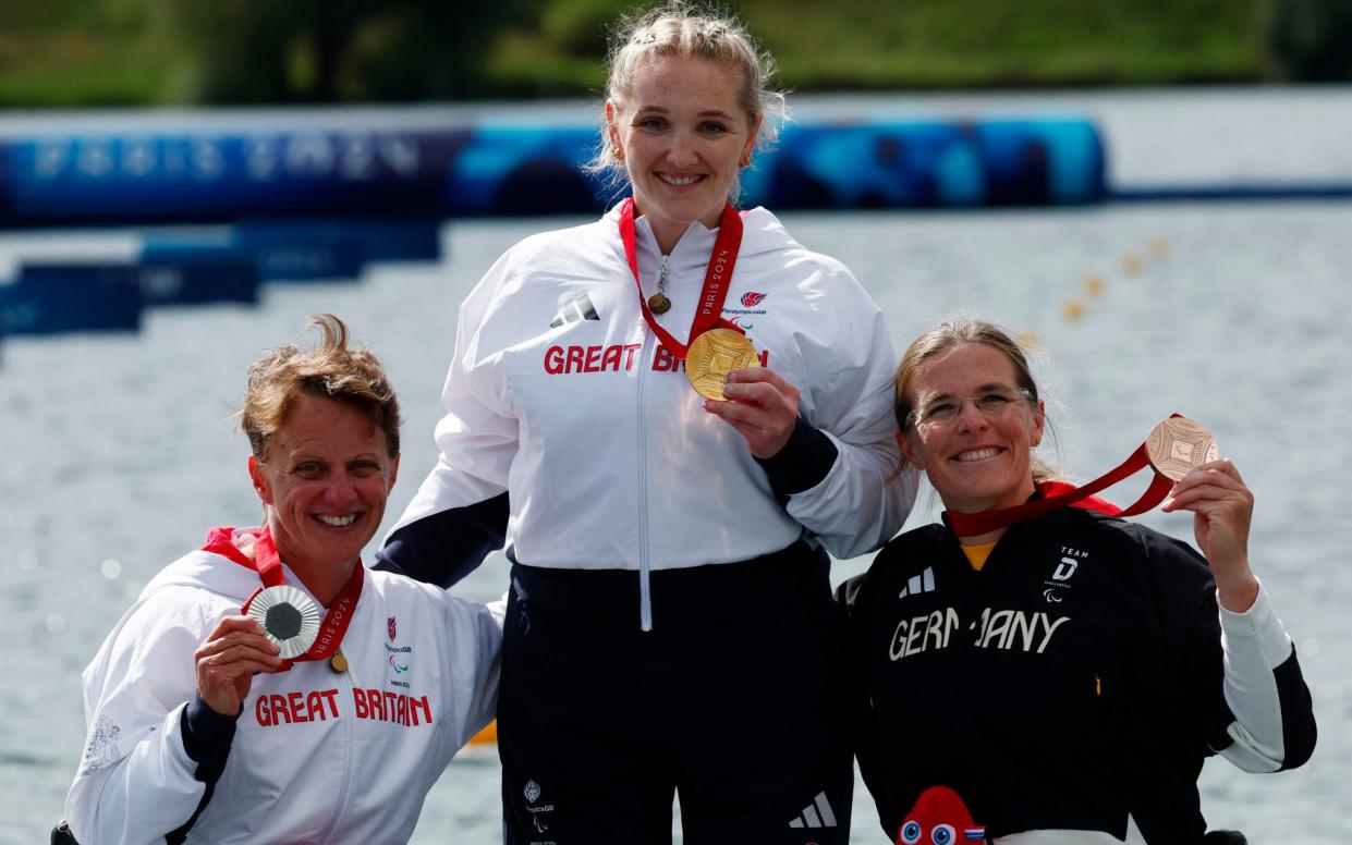 Charlotte Henshaw (centre) won her second gold medal of the Games on Sunday morning in the women's kayak single 200 metres KL2, with her fellow Briton Emma Wiggs (left) taking silver