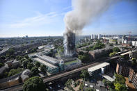 <p>JUN. 14, 2017 – Smoke rises from the building after a huge fire engulfed the 24 storey residential Grenfell Tower block in Latimer Road, West London in the early hours of the morning in London, England. The fire claimed more than 70 lives and left hundreds homeless. (Photo: Leon Neal/Getty Images) </p>