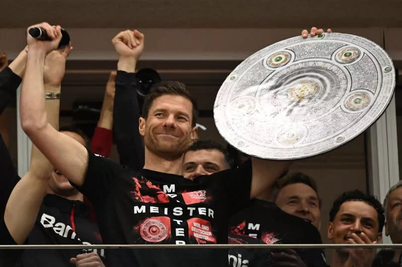 Bayer Leverkusen manager Xabi Alonso celebrates winning the Bundesliga