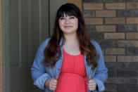 Reyna Montoya stands outside her home Thursday, June 4, 2020, in Gilbert, Ariz. Every Monday, Montoya wakes up extra early and logs onto the Supreme Court's blog, hitting refresh over and over again to find out if it's ruled on the Obama-era program that shields her from deportation. (AP Photo/Matt York)