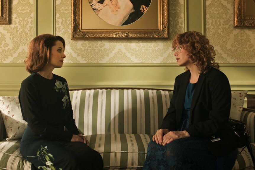 (l-r) Charlotte Collins (Lara Jean Chorostecki) and Miss Fairchild (Annie Briggs) speak on a striped couch in Chucky 302 -- “Let the Right One In”