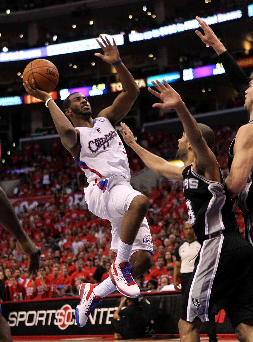 LOS ANGELES, CA - MAY 19: Chris Paul #3 of the Los Angeles Clippers goes up for a shot against Tony Parker #3 of the San Antonio Spurs in Game Three of the Western Conference Semifinals in the 2012 NBA Playoffs on May 19, 2011 at Staples Center in Los Angeles, California. The Spurs won 96-86 to take a three games to none lead in the series. NOTE TO USER: User expressly acknowledges and agrees that, by downloading and or using this photograph, User is consenting to the terms and conditions of the Getty Images License Agreement. (Photo by Stephen Dunn/Getty Images)