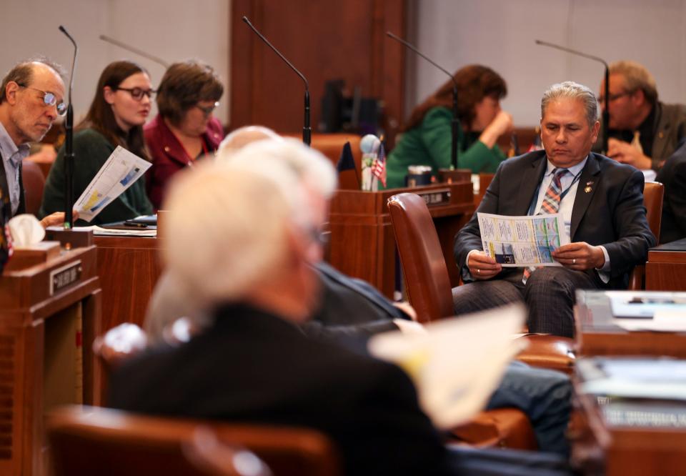 Senators look over reading material about the effects of Daylight Saving Time on Tuesday at the Oregon State Capitol.