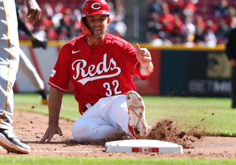 Apr 2, 2023; Cincinnati, Ohio, USA; Cincinnati Reds first baseman Jason Vosler (32) is safe at third base against the Pittsburgh Pirates during the eighth inning at Great American Ball Park.