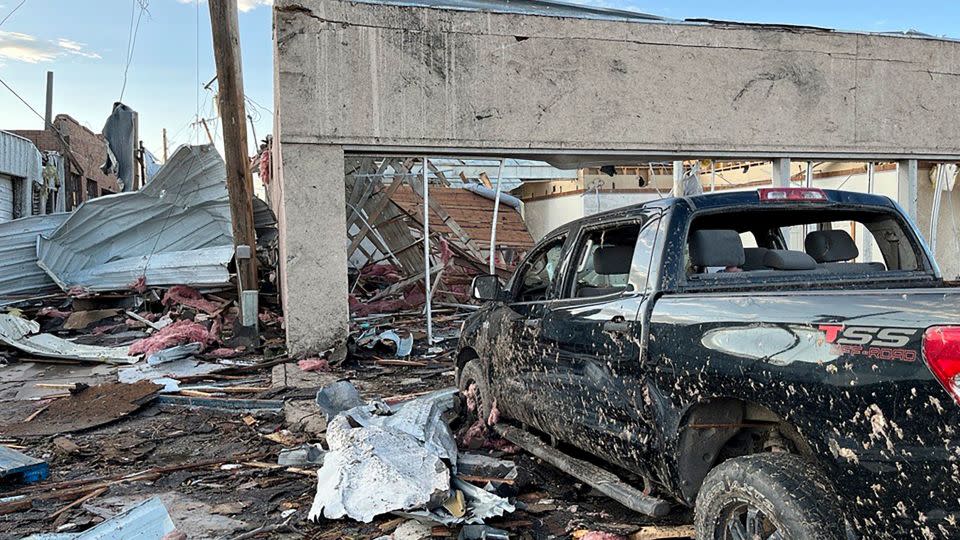 Buildings and a vehicle are damaged after a tornado in Perryton, Texas, Thursday. - Alex Driggars/Lubbock Avalanche-Journal/AP