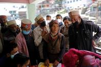 The Wider Image: Doctors scale rockslides, invoke gods to vaccinate Himalayan villages