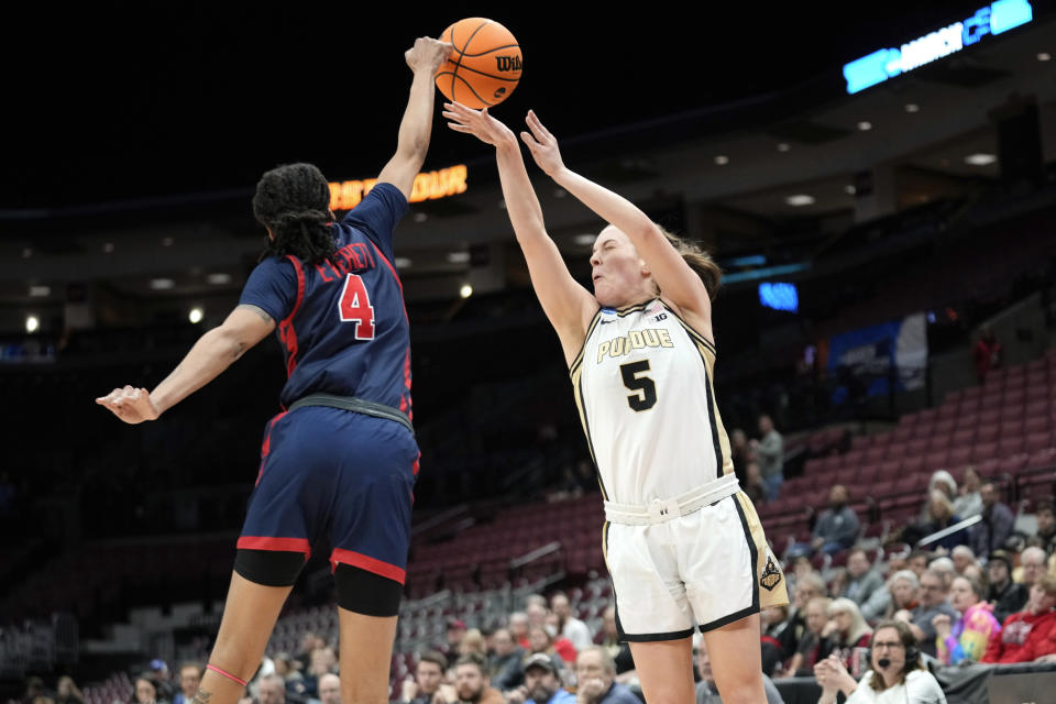 St. John's guard Jayla Everett (4) blocks a Purdue guard Cassidy Hardin (5) shot in the second half of a First Four women's college basketball game in the NCAA Tournament Thursday, March 16, 2023, in Columbus, Ohio. (AP Photo/Paul Sancya)