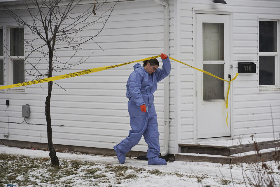 Forensic investigators work at the scene of an ongoing investigation regarding five deaths in southern Manitoba, in Carman, Manitoba, Monday, Feb. 12, 2024. A Canadian man has been charged with five counts of first-degree murder in the deaths of his wife, three young children and a 17-year-old female relative, authorities said Monday. (David Lipnowski/The Canadian Press via AP)