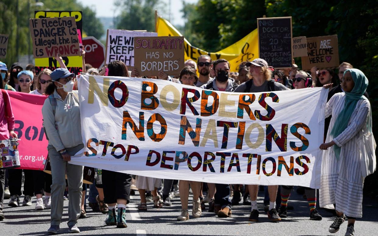 An earlier protest against the Rwanda bill near Gatwick airport