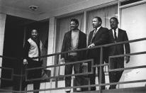 <p>Rev. Martin Luther King Jr. stands with other civil rights leaders on the balcony of the Lorraine Motel in Memphis, Tenn., a day before he was assassinated at approximately the same place, April 3, 1968. From left are Hosea Williams, Jesse Jackson, King, and Ralph Abernathy. (AP Photo) </p>