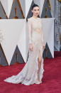 Rooney Mara sticks to what she knows in a beaded white Givenchy dress, with a daring cut-out detail around the midriff.