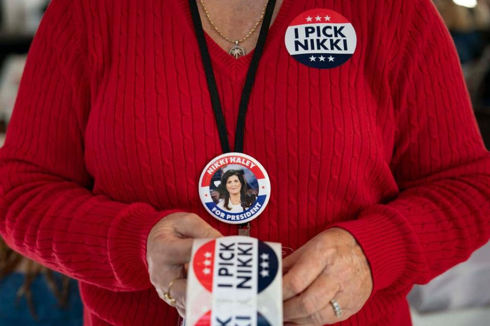 A woman holds stickers before US Republican presidential hopeful and former UN Ambassador Nikki Haley speaks at a campaign event at Summerville Country Club on February 13, 2024 in Summerville, South Carolina. (Photo by Allison Joyce / AFP) (Photo by ALLISON JOYCE/AFP via Getty Images) ORG XMIT: 776105297 ORIG FILE ID: 2001184797