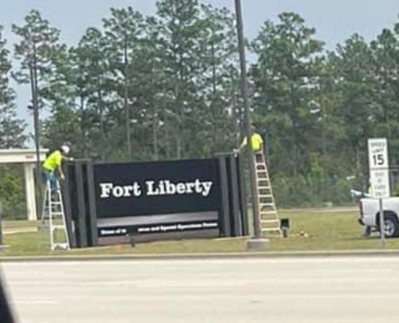 Reader Frank Manness captured this picture of workers installing a sign for Fort Liberty, the new name for Fort Bragg.
